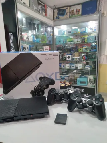 Playstation 2 com varios jogos e com garantia de 01 ano.