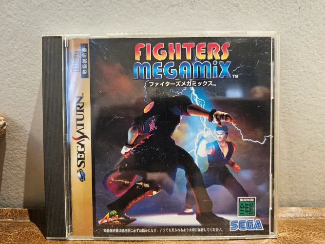 Fighters Megamix - Sega Saturn (japonês, completo c/ spine card). Impecável. <br>180.