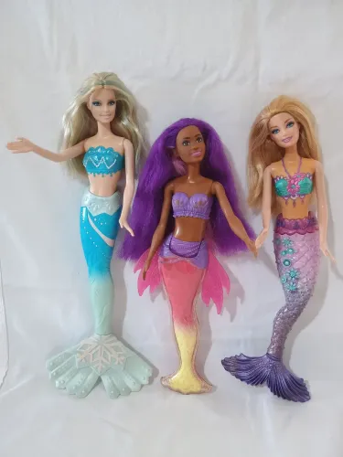 Três bonecas Barbie sereias
