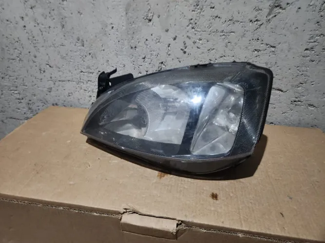 Farol esquerdo Corsa frente Montana 03/12 original máscara negra