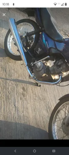Vem com escape estrala ou um escape esportivo pra negocio no original da cg Titan 125