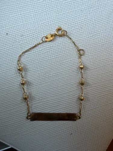 pulseira infantil de ouro, com corrente de bolinhas e placa para gravação. peça usada,