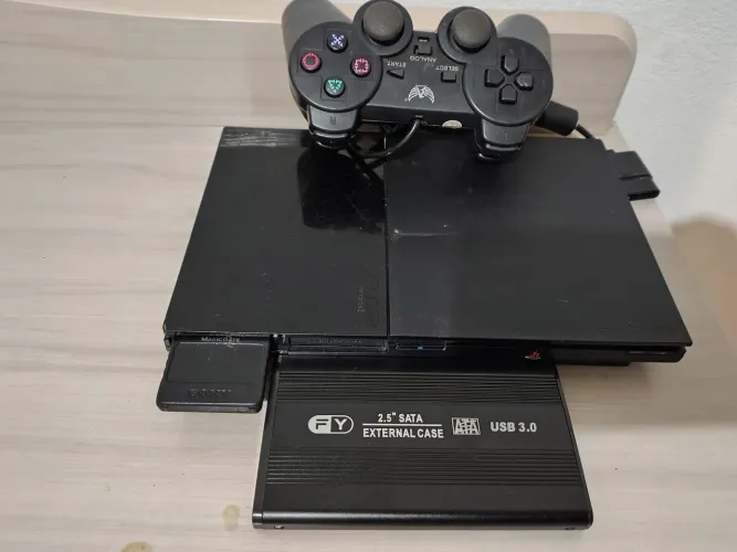 PS2 com 107 jogos um controle e memory card