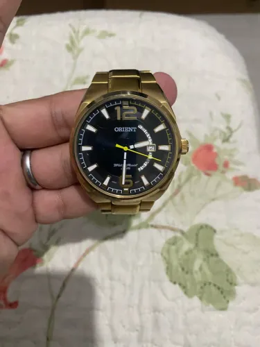 Vendo relógio orient dourado semi-novo 