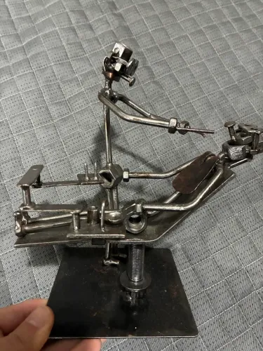 Escultura de metal dentista e paciente
