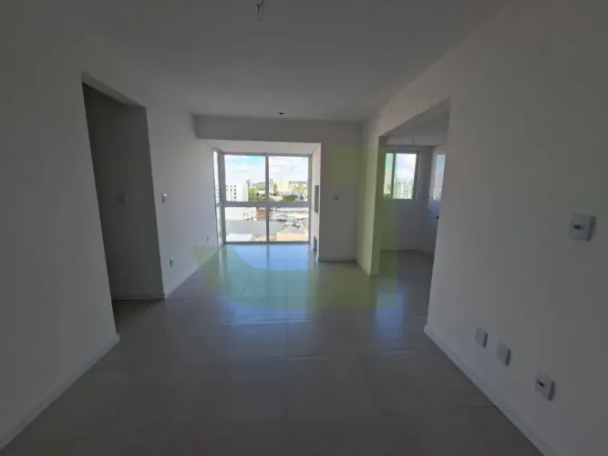 Apartamento novo com 2 dormitórios (sendo 1 suíte), sacada com churrasqueira no Centro de 