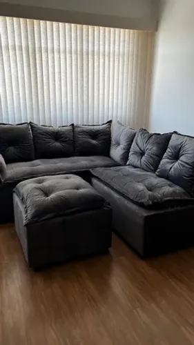 Sala sofá de canto com puff