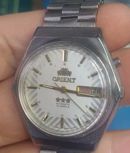 Relógio Orient 46941 mostrador branco listrado
