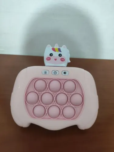 Brinquedo pop It anti stress eletrônico na cor rosa unicórnio novo
