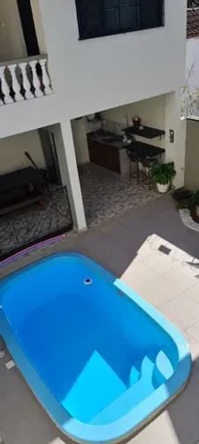 Harmonia no Centro: Sobrado Exclusivo com Quatro Quartos, Suíte e Versatilidad Centro - Ta