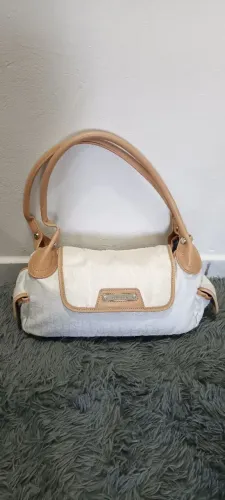 Bolsa em tecido com acabamento em couro