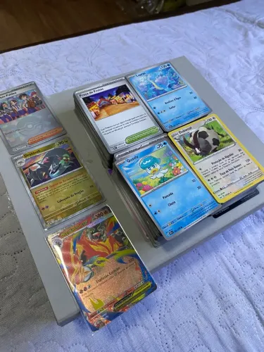 Bulk de cartas pokemon + mega emboar