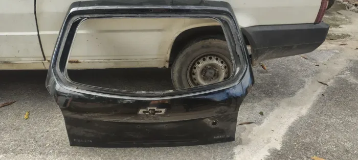 Tampa traseira da mala Chevrolet celta 2008 a 2015 original c detalhe 
