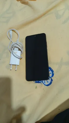 Celular redimi 11 conservado com carregador e campina