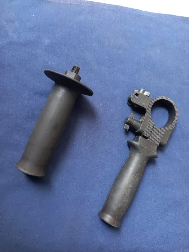 Empunhadeira de máquina portátil rotativa