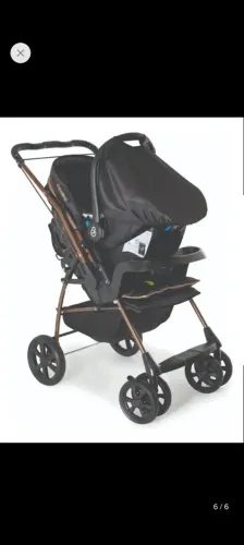 Carrinho com bebe conforto galzerano