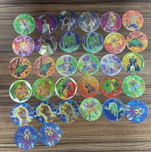 lote 46 tazos yugioh magic e arma e voa