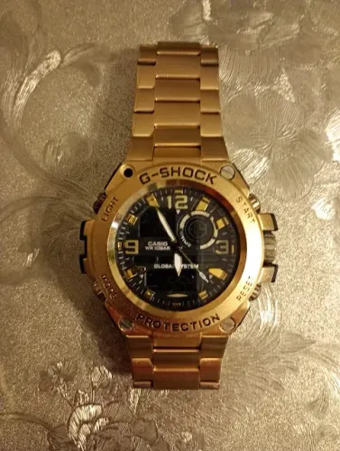 Relógio g-shock dourado analógico e digital
