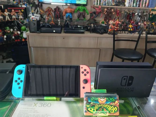 Nintendo switch cartão 64gb lotado de jogos + case de brinde ótimo estado ac trocas..