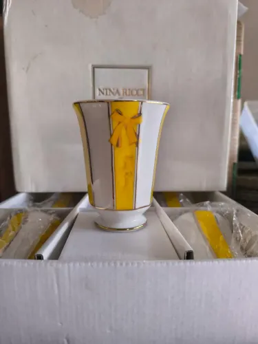 5 peças Nina Ricci.