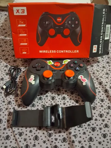 1 Controle X3 Bluetooth + 1 Suporte para celular + 1 cabo carregador
