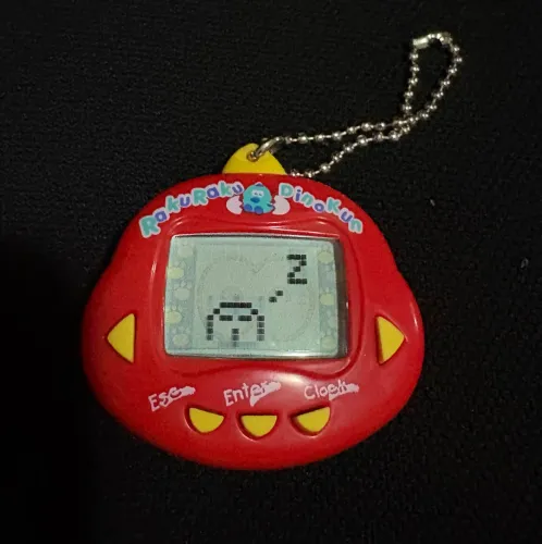 Tamagotchi Rakuraku Dinokun + Brinde