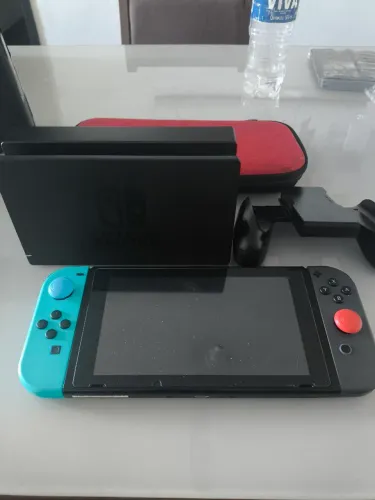Leia o anúncio por gentileza Nintendo switch modelo V1 SD de 128 com jogos