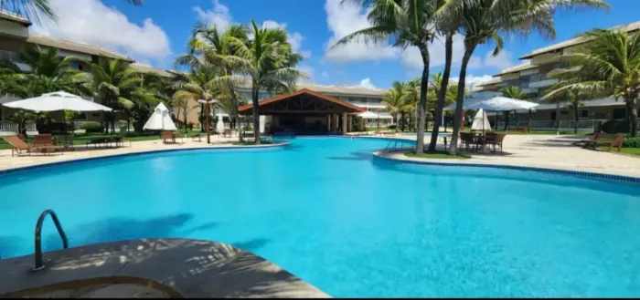 Apartamento mobiliado com 125 m2, com 3 suites e lavabo em condominio Pé na areia, frente