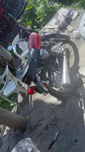Moto cg 77 com nota . A cor dele é laranja 