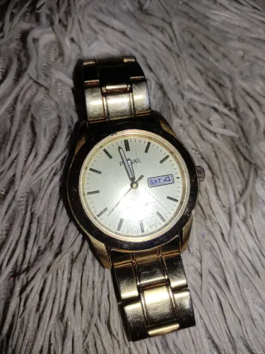 Relógio pulsar kinetic dourado