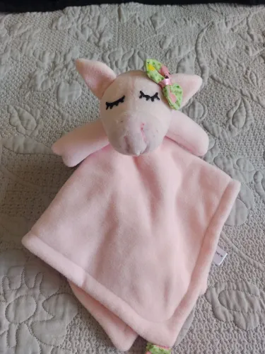 Naninha de pelúcia rosa com laço