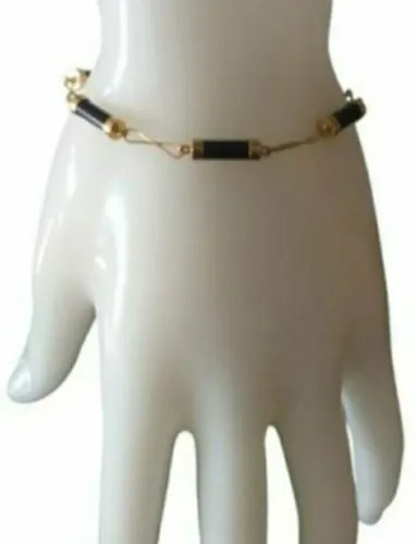 PULSEIRA ITALIANA, EM OURO AMARELO 18K, COM ÔNIX.