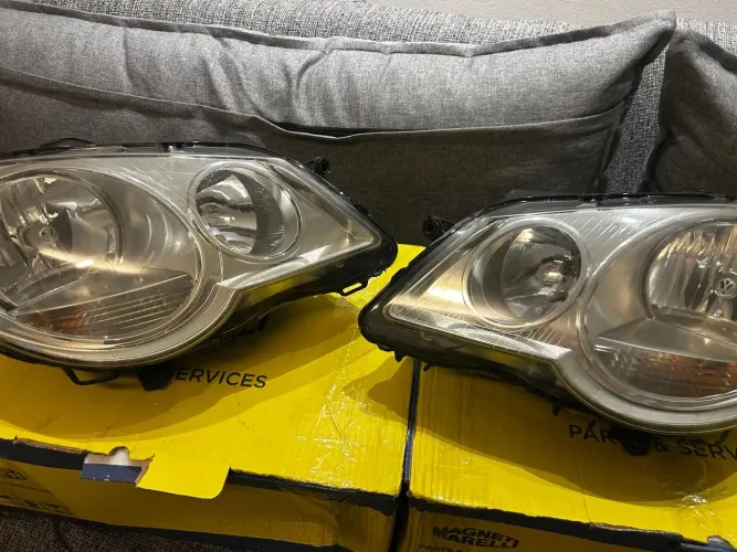 Par de farol Polo 2007 a 2014 Original VW (Usado) Máscara Cromada
