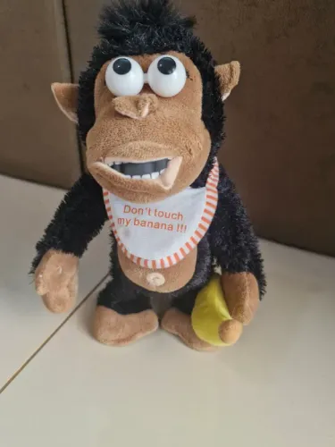 Brinquedo antigo interativo- o macaco grita e chora ao tirar a banana