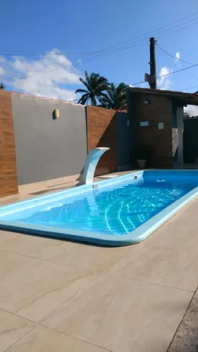 Casa com piscina para temporada no condomínio Joia do Atlântico