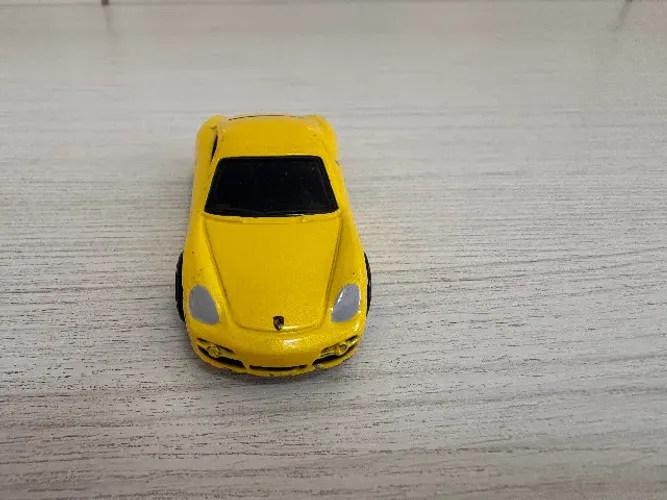 Hot Wheels Porsche Cayman S amarelo - usado sucata - leia