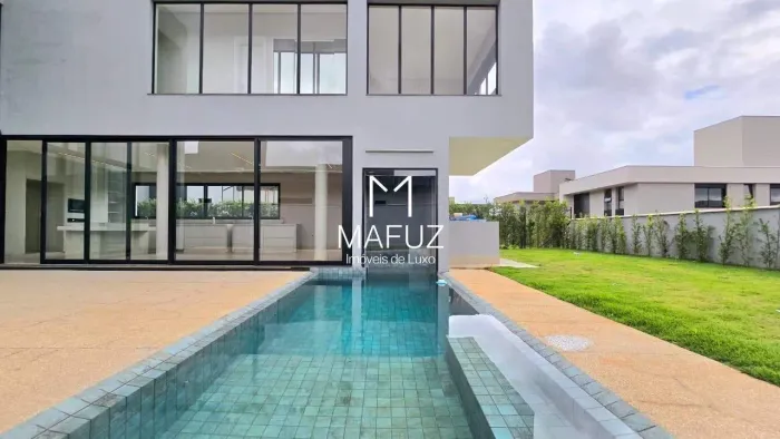 CASA À VENDA COM 4 SUÍTES, PISCINA INTEGRADA À SAUNA E PÉ-DIREITO DUPLO - Alphaville Lagoa
