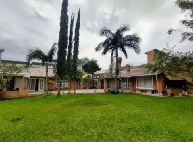 Casa com 4 dormitórios para alugar, 520 m² por R$ 7.650,00/mês - Guarujá - Porto Alegre/RS