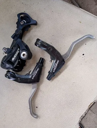 Câmbio DEORE 1X9 mais manetes freio semi novos sem folga não envio nem faço Olx play .