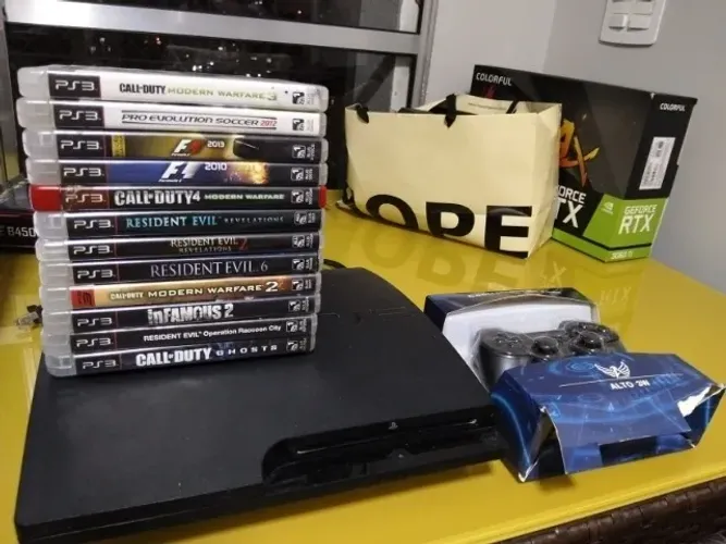 Console Playstation 3 Slim - 320gb - 2 controles paralelos e 11 jogos.
