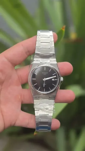 Tissot PRX preto com pulseira de aço