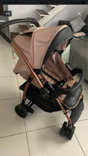Carrinho de bebê burigotto com bebê conforto
