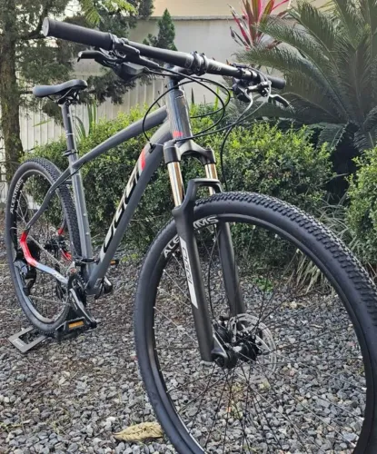 Bicicleta Oggi Big Wheel 7.0 - 18vel Cues - Nova