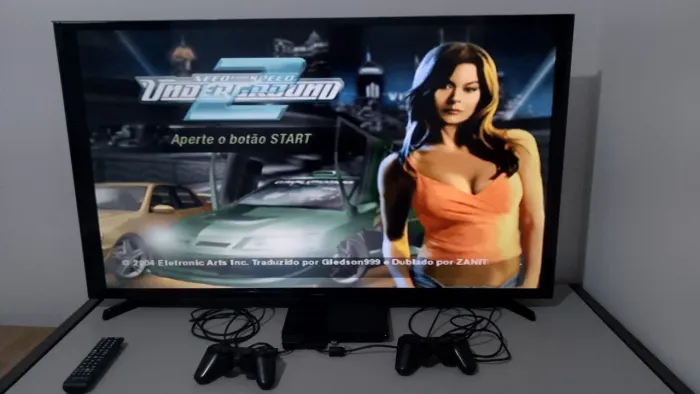 PS2 slim 02 controles e vários jogos