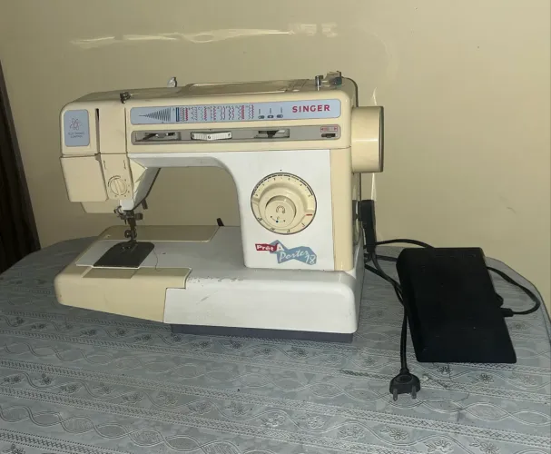 maquina de costura singer pret a porter 18.