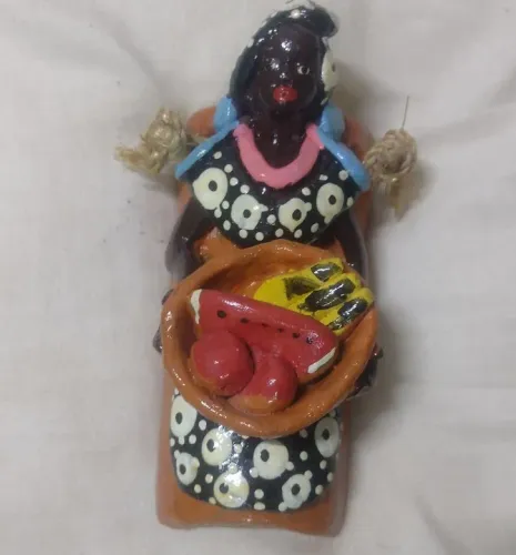 Boneca preta de parede