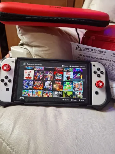 NINTENDO SWITCH OLED DESBLOQUEADO NOVO COM 512GB NA CAIXA COM CASE E GRIPS