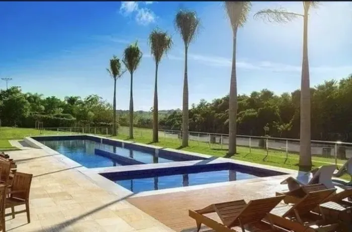 Terreno plano murado à venda no Condomínio Alphaville 2, Granja Marileusa, 498m²