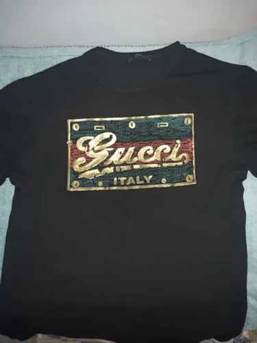 GUCCI.   VERSACE....