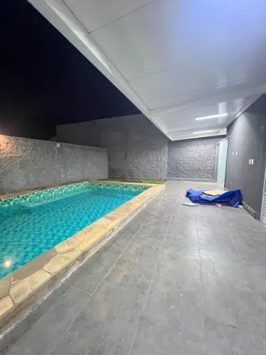Casa térrea com 4 quartos, sendo 1 suíte, área de churrasco com piscina no Privê Atlântico